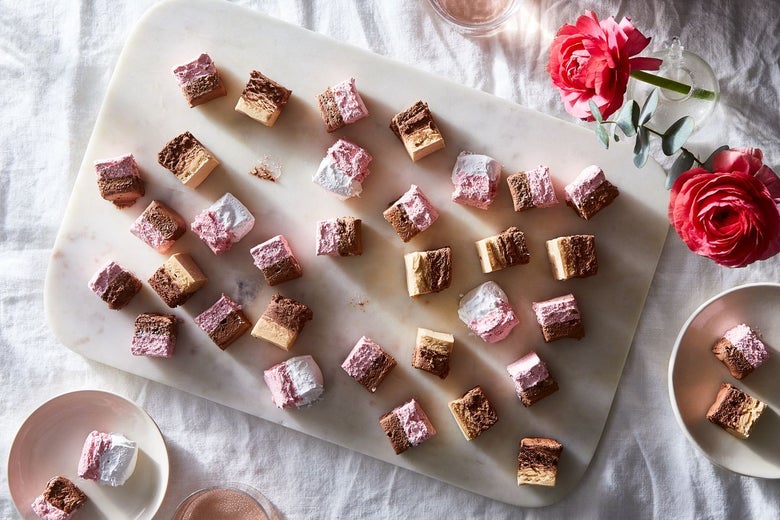 Squares of nougat in various shades: pink, white, dark brown, light brown.